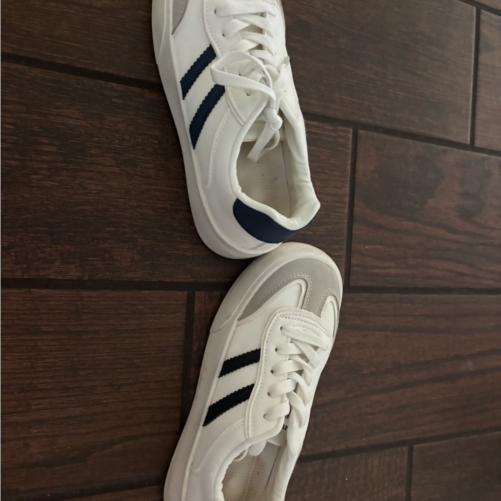 Two pairs of new white sneakers- Navy Stripes & black stripes. Size 7.